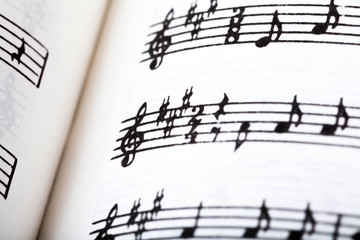 Key signature symbol and violin clef. Musical notation macro, closeup. Single line sheet music...