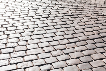 Simple grey convex square stone pavement surface, paving, causeway outdoors background texture, light reflections Sidewalk, promenade cobblestone floor, street, road outside top view pattern copyspace