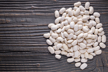 Fresh organic natural beans on wooden rustic background