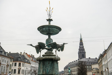 Fototapeta premium Famous Stork Fountain on Amagertorv square in historical center of Copenhagen, Denmark. February 2020
