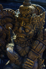 Fototapeta na wymiar Ancient Balinese statue at the temple