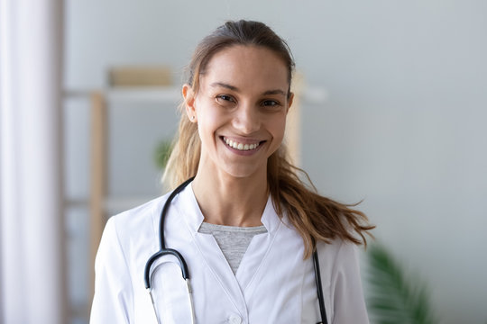 Head Shot Portrait Smiling Mixed Race Female Doctor In Uniform