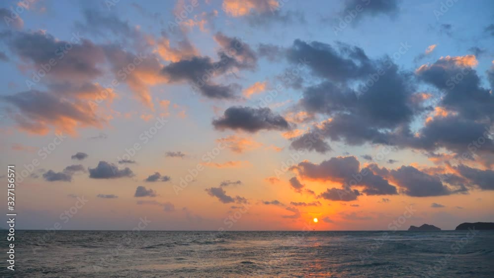 Wall mural Sunset time above the sea, static shot