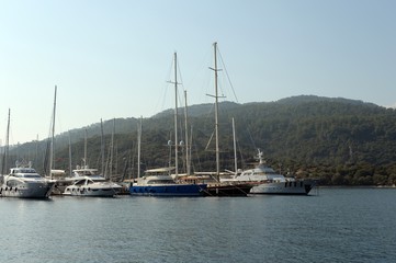 Fototapeta premium Sea yachts at the pier of the yacht club in the Turkish city of Marmaris