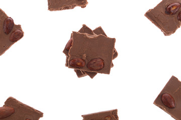Dark chocolate pieces isolated on white background