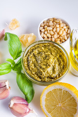 Delicious traditional Italian pesto sauce on a white background