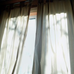 Morning light through curtains