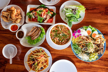 Thai food group for lunch, papaya salad, grilled pork, fried chicken 