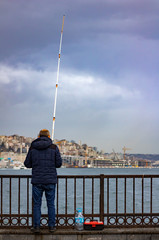 Obraz premium fisherman in city of istanbul bosphorus