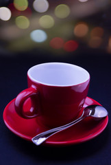coffee red cup and coffee beans on bokeh background