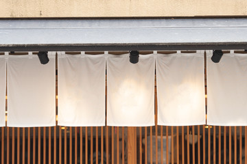 The curtain-like fabric that hangs in front of traditional Japanese restaurants and shops not only serves as a signboard, but holds a larger meaning,