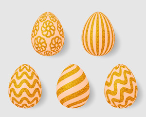 Set of Easter eggs with gold ornaments. Golden textured pattern of flowers, stripes and lines. Isolated on a light background