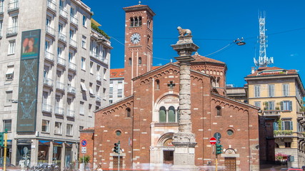 Church of San Babila timelapse and the column with lion on the top on Avenue Buenos Aires in Milan - obrazy, fototapety, plakaty