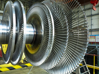 Power generator steam turbine in repair process, machinery, pipes, tubes at power plant © alexrow