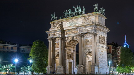 Fototapeta na wymiar Arch of Peace in Simplon Square timelapse at night. It is a neoclassical triumph arch