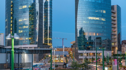 Fototapeta na wymiar Milan skyline with modern skyscrapers in Porta Nuova business district day to night timelapse in Milan, Italy, after sunset.
