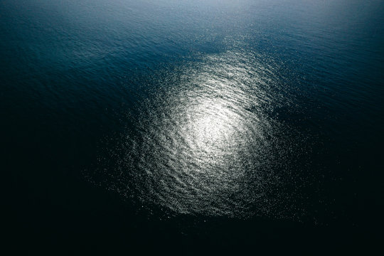 Aerial Top Down View Photo Of Azure Blue Ocean Waves Showing Beautiful Bright And Deep Blue Color From Sea Reef Shallow Water Near Tropical Island Popular Tourist Destination For Summer Vacation