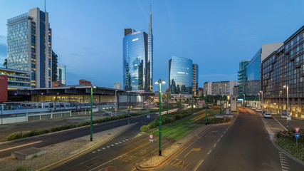 Milan skyline with modern skyscrapers in Porta Nuova business district day to night timelapse in Milan, Italy, after sunset.