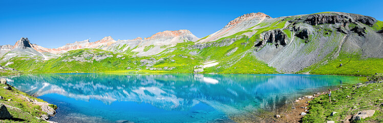 Panoramic view of turquoise vibrant Ice lake near Silverton, Colorado on summit rocky mountain peak and snow in August 2019 summer panorama - obrazy, fototapety, plakaty