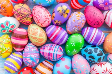  Beautiful colorful easter eggs on blue wooden © Apiwan