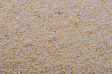 natural organic semolina on white acrylic background
