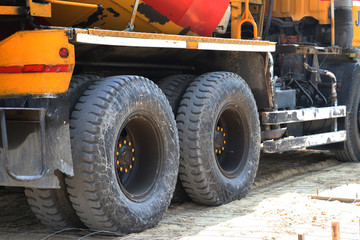 Close up Cement truck, pouring cement into a foundation