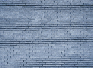 a full frame blue toned textured brick wall background