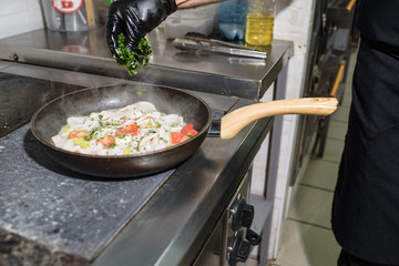 The process of roasting squid. Delicious seafood.