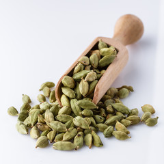 fragrant green cardamom on a white acrylic background