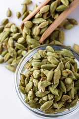 fragrant green cardamom on a white acrylic background