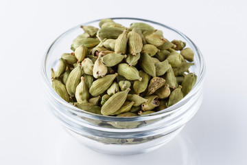 fragrant green cardamom on a white acrylic background