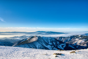 beautiful panoramic view of mountains from low Tatras to Carpathian mountains, morning at sunrise with fog in valley, slovakia low tatras, dumbier, tatras