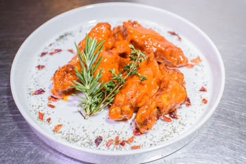 Grilled wings in spicy spicy sauce. Tasty and junk food.