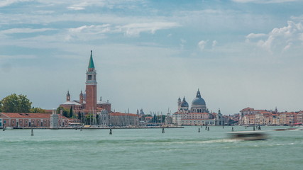Fototapeta premium Panoramic sea view of the San Giorgio Maggiore island and basilica Santa Maria della Salute timelapse in Venice, Italy.