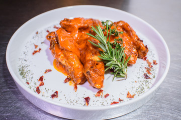 Grilled wings in spicy spicy sauce. Tasty and junk food.