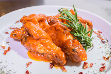 Grilled wings in spicy spicy sauce. Tasty and junk food.