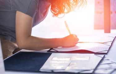 Parent teacher appointment PTA at school concept. Hand of attendee register sign up in registaion paper student at desk in front of education conference.