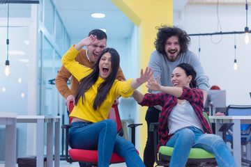 Group of  Creative office workers collaborate together making joke with each other during their work inside office. succes and competition business concept