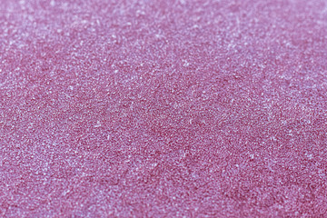 Red frosty metal surface close up.