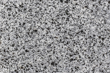 Black and white smooth granite surface.