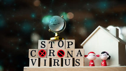 Concept Coronavirus. Prevent or stop the spread of the covic-19 worldwide. Letters on the wooden floor resting on a wooden table. Tourists stop travel to travel from China. And related country