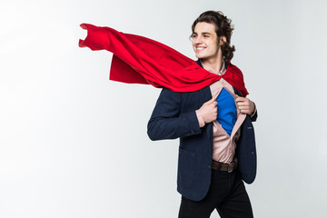 Young business man tearing apart his shirt revealing superhero suit, isolated on white background © F8  \ Suport Ukraine