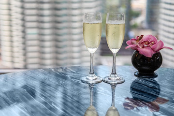 champagne glass with a beautiful view from the window at the Petronas Towers
