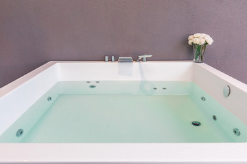 Jacuzzi with flowers and blue water