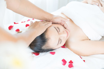 Head massage spa helps to relax. Asian woman receiving head massage in spa wellness center.