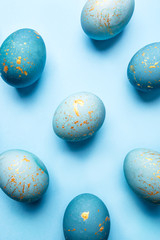 Fototapeta na wymiar Easter background of eggs painted in blue color. Flat lay, top view.