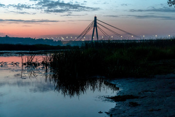Fototapeta premium Sunrise sky near the water vibe colors