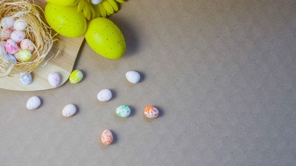 Easter colored eggs, small and many on a natural background.