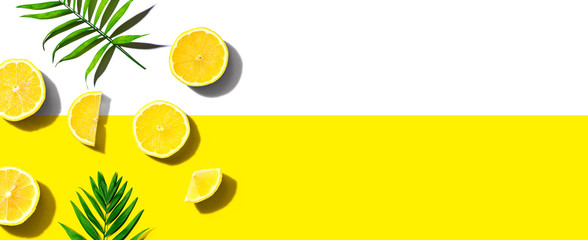 Fresh yellow lemons overhead view - flat lay - obrazy, fototapety, plakaty