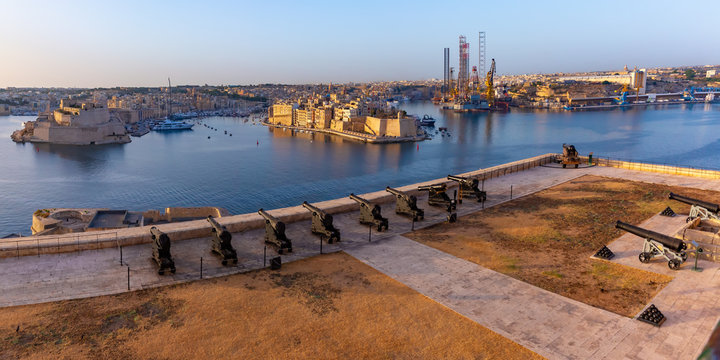Saluting Battery at Fort Lascaris as seen from Upper Barrakka Gardens, with Grand Harbor, Senglea and Brigu on the background, Valletta, Malta.